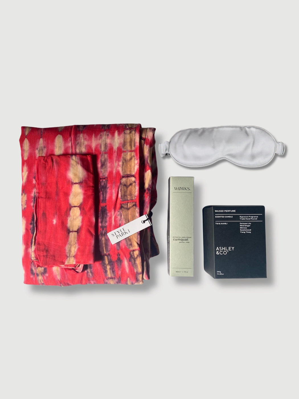 Luxury pink kimono gift set with robe, candle, hand cream and silk sleep mask that comes presented in a gift box