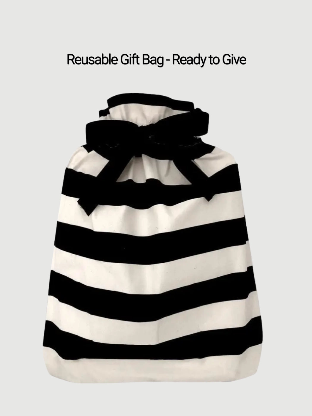 Reusable black and white striped gift bag ready to give wellness gift set